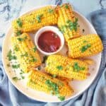 Air Fryer Corn on the Cob on white plate