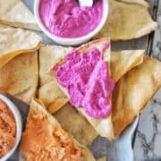 Dips and pita chips on a large platter board