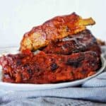 Mexican ribs on plate with grey napkin with below.
