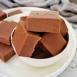 Microwave Chocolate Fudge pieces in small bowl on white pate